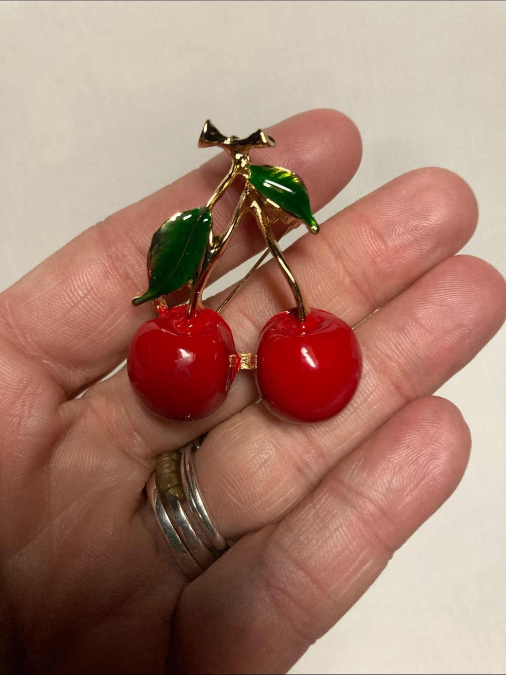 Gold-Tone Cherry Brooch with Red Enamel Cherries and Green Leaves